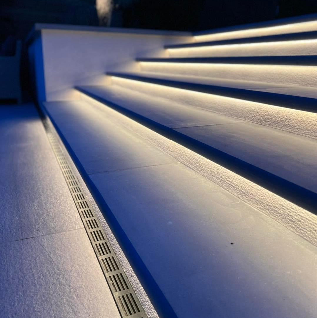 Bespoke Blue Limestone Steps with lighting underneath.