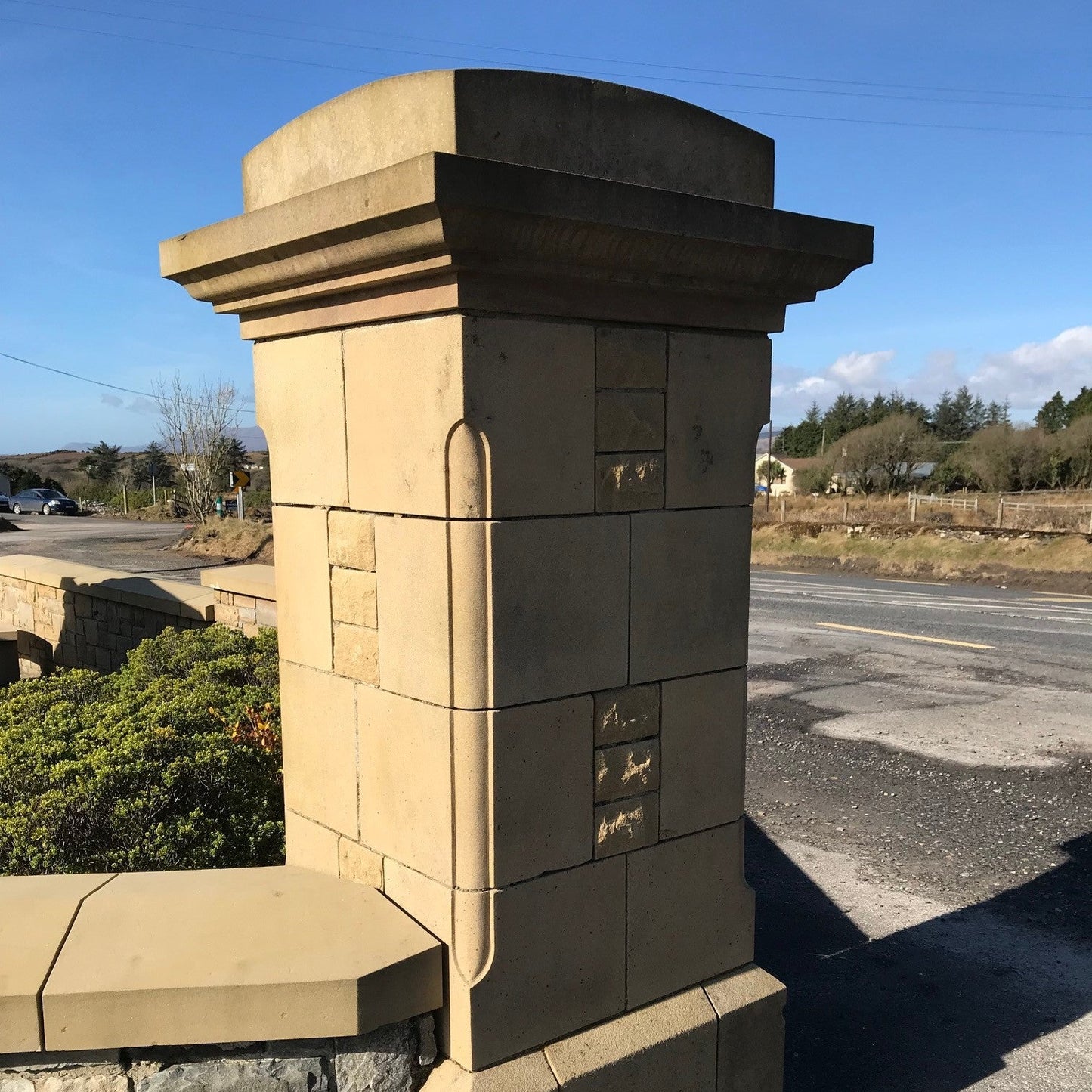 Bespoke sandstone pillar design with sandstone moulded pier cap.