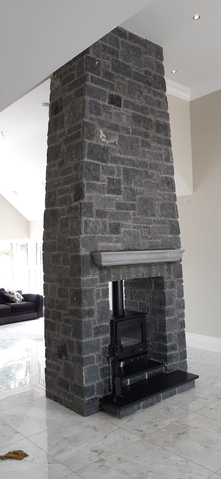 Bespoke Blue Limestone Mantel with moulded profile on a large double sided Blue Limestone Building Stone Fireplace.
