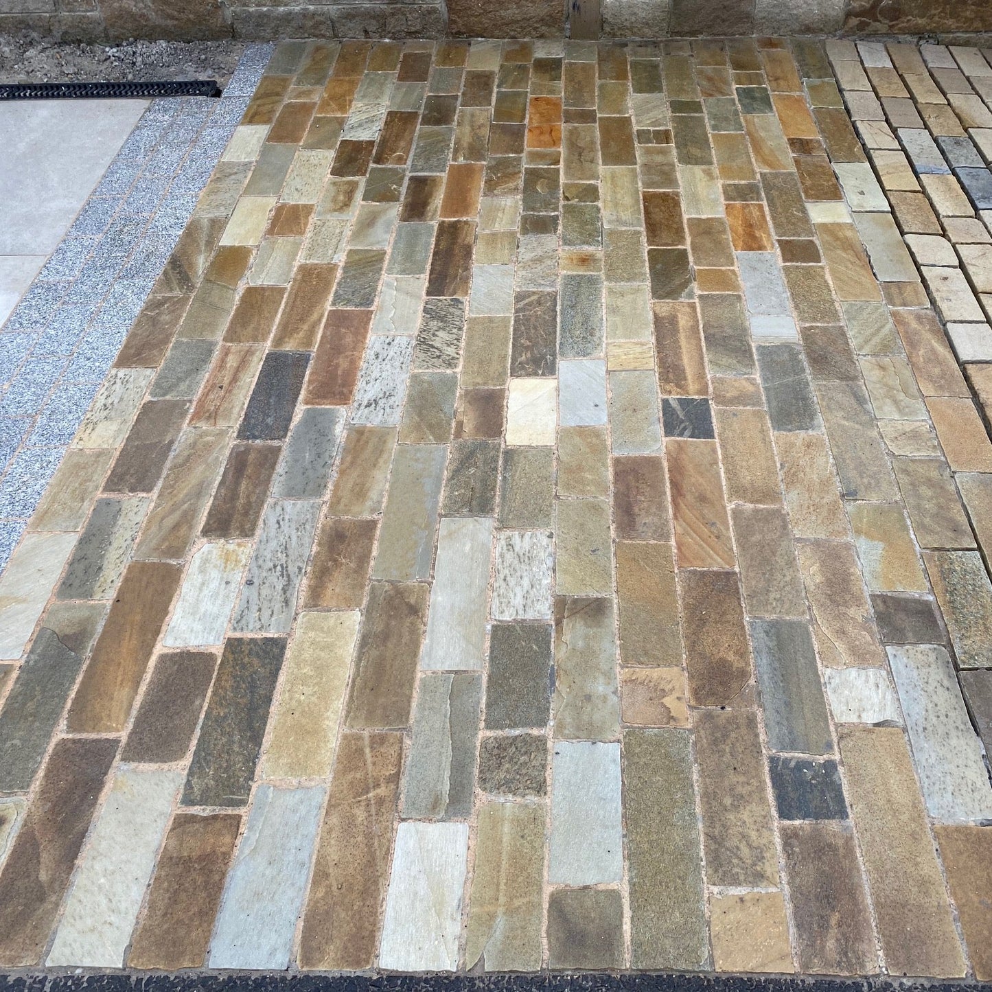 McMonagle Stone display area featuring Donegal Quartzite Paving Setts in Random Length x 100mm.