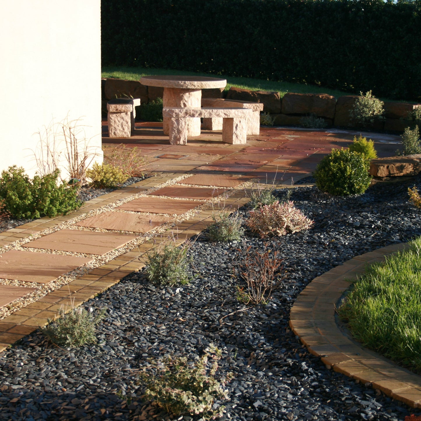 Patio area and pathway completed using Modak Sandstone Paving.