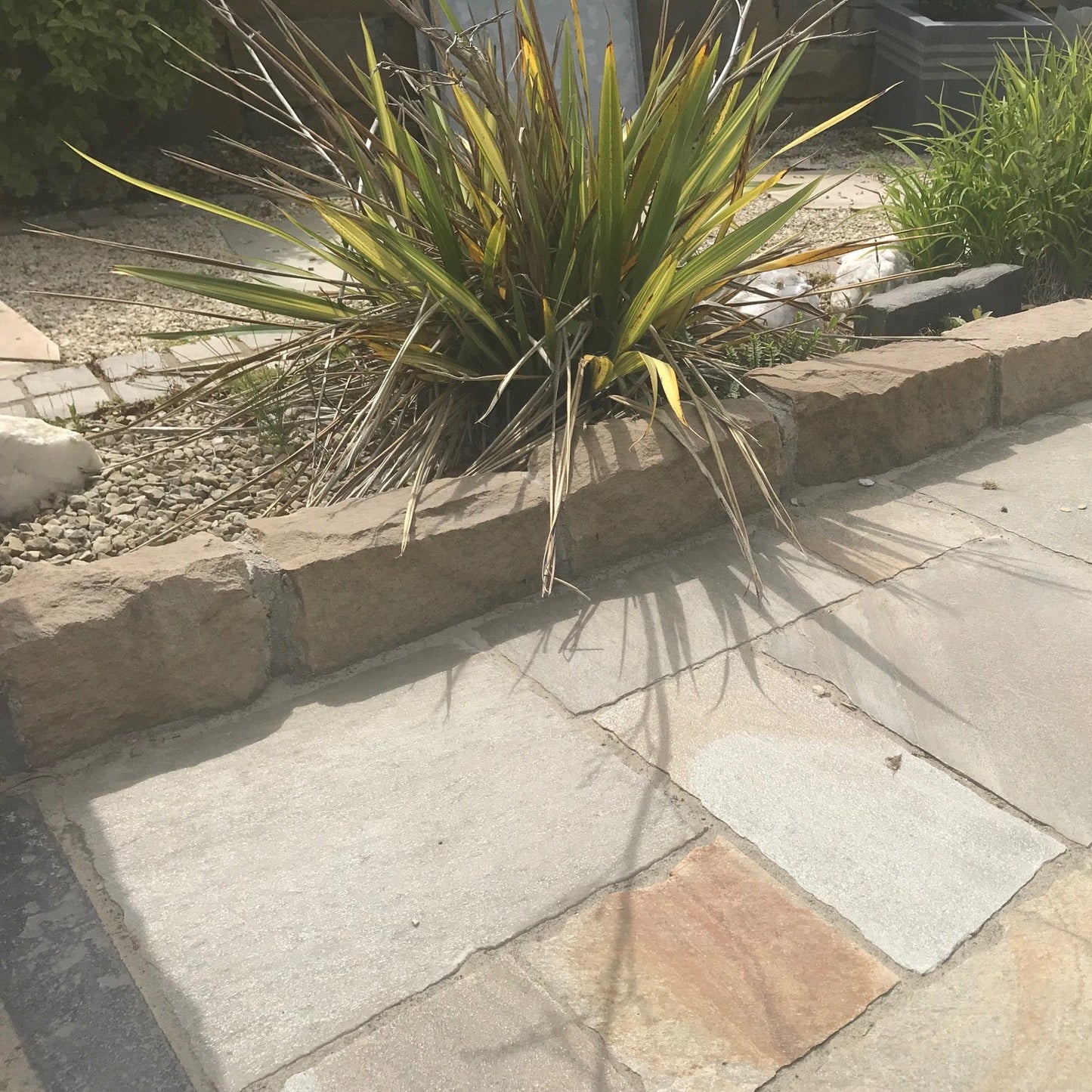 Patio edging completed using Mountcharles Sandstone Kerbing.
