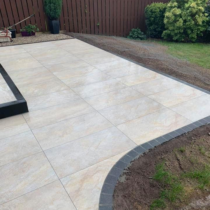 Garden and patio area featuring Pietra Di Barge porcelain tiles.