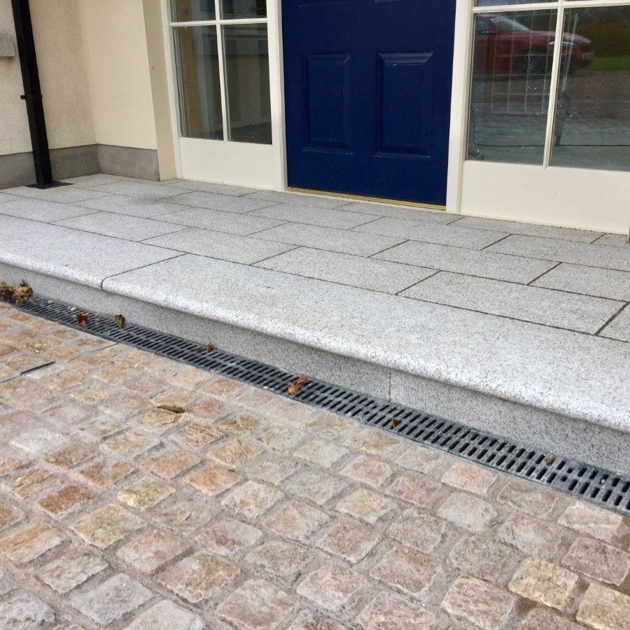 STORA LIGHT PVC 80mm Channel Drain installed at step leading up to house entrance.