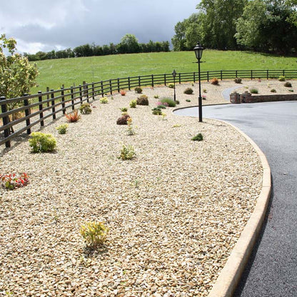 Driveway with large planted rockery areas completed with 14mm Gold Donegal Quartzite Stone Chipping.