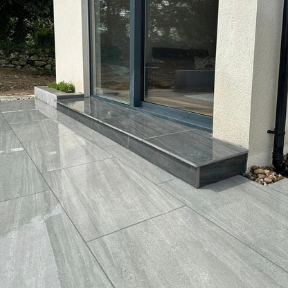 Patio leading up to house step. Paving is Ashen Jewel Range Porcelain Paving tiles.