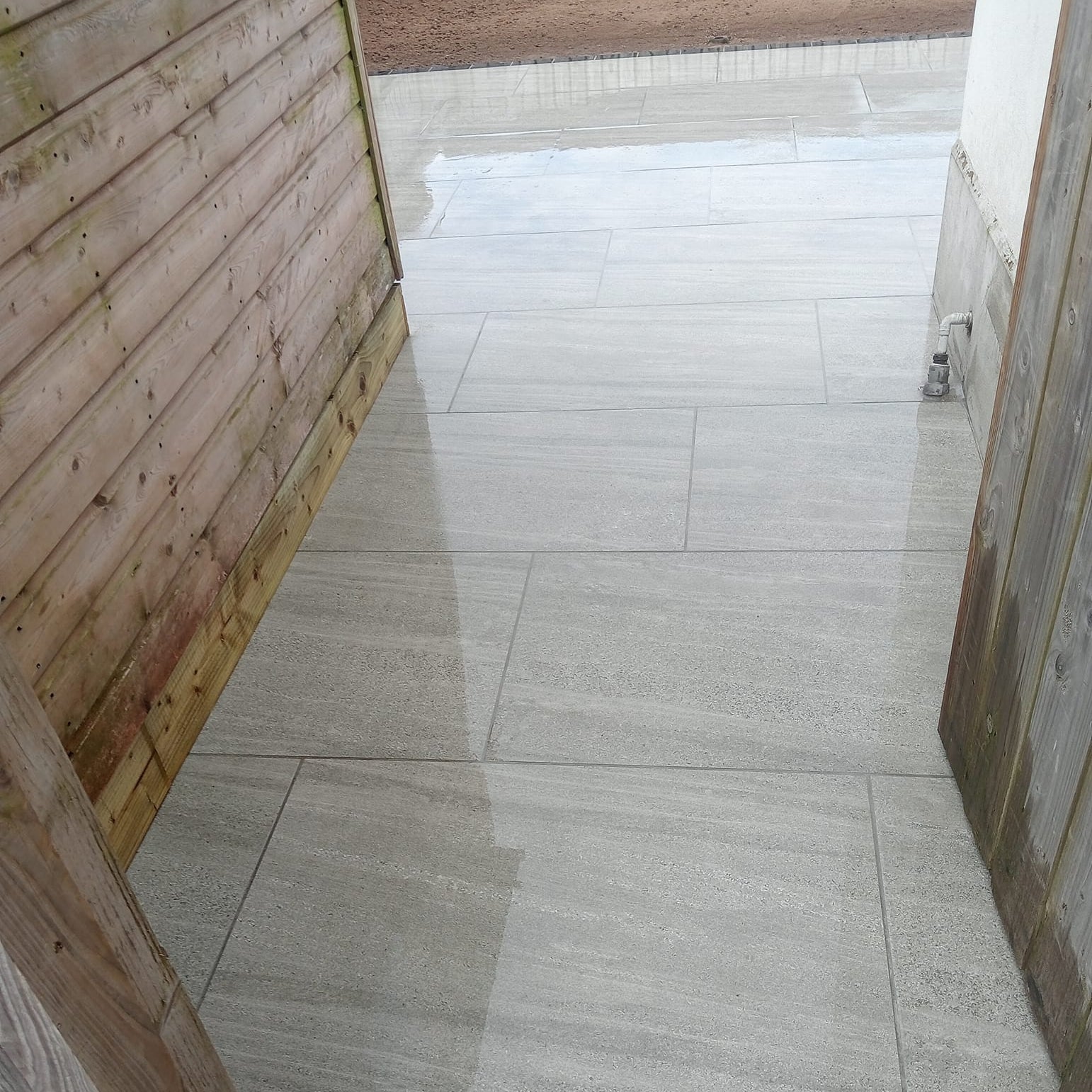 Pathway leading to patio area. Paving is Ashen Jewel Range Porcelain Paving Tiles. 