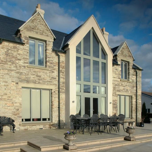 Contemporary home completed in Atlantic Grey Donegal Quartzite Machined walling stone. 