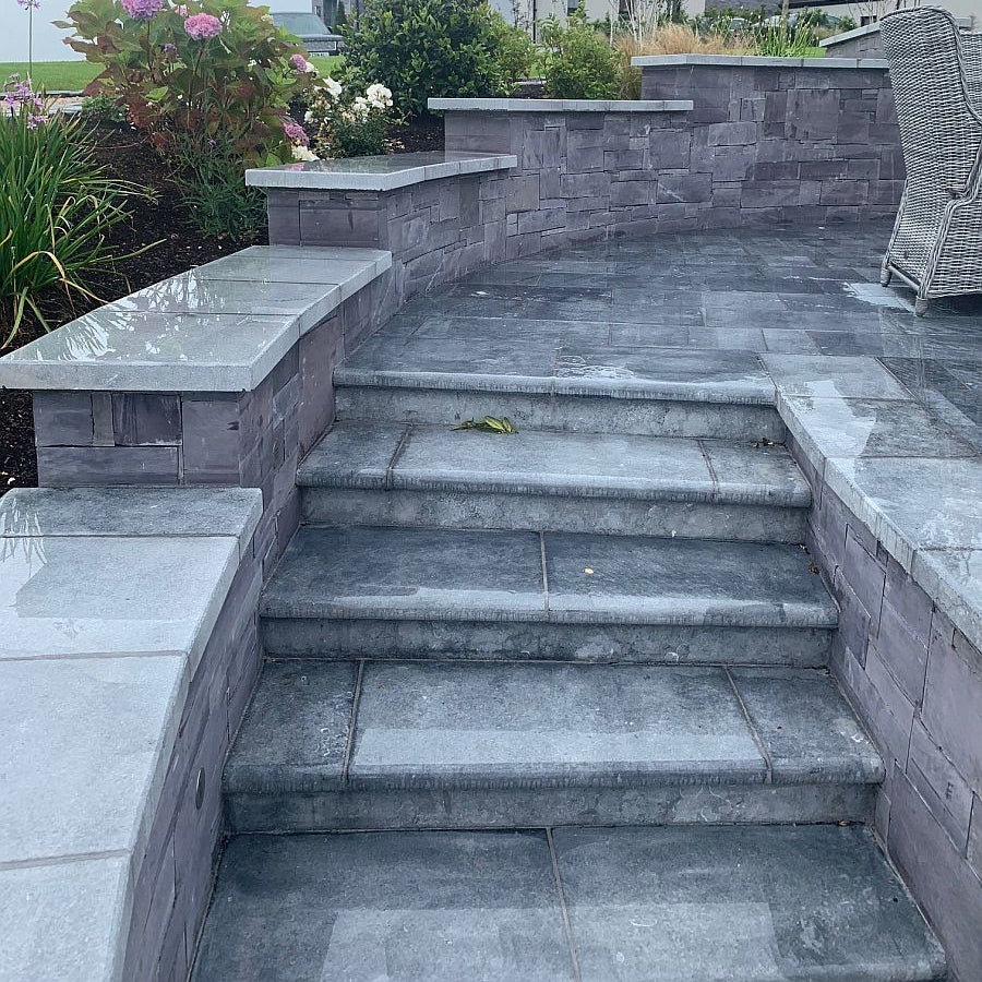 Bespoke Blue Limestone Steps leading up to a limestone patio area.