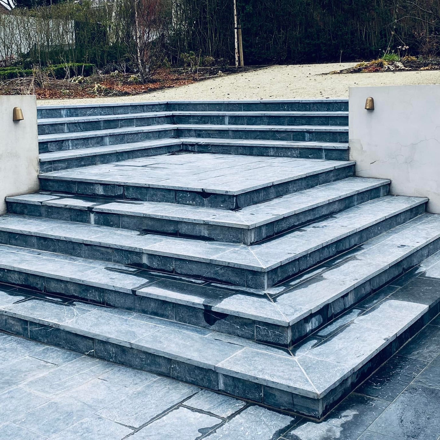 Bespoke Blue Limestone Steps leading away from a patio area.