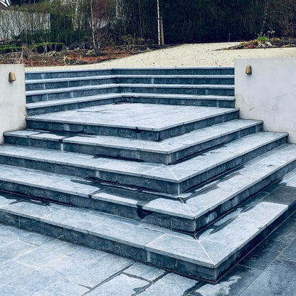 Bespoke Blue Limestone Steps leading away from a patio area.