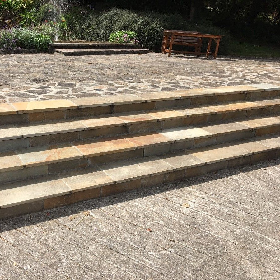 Bespoke Donegal Quartzite Steps leading up to a patio area. 