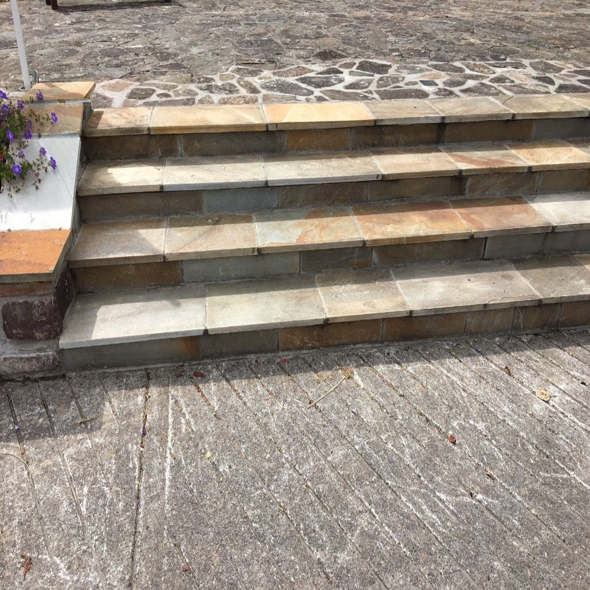 Bespoke Donegal Quartzite Steps leading up to patio area.