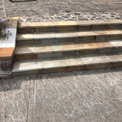 Bespoke Donegal Quartzite Steps leading up to patio area.