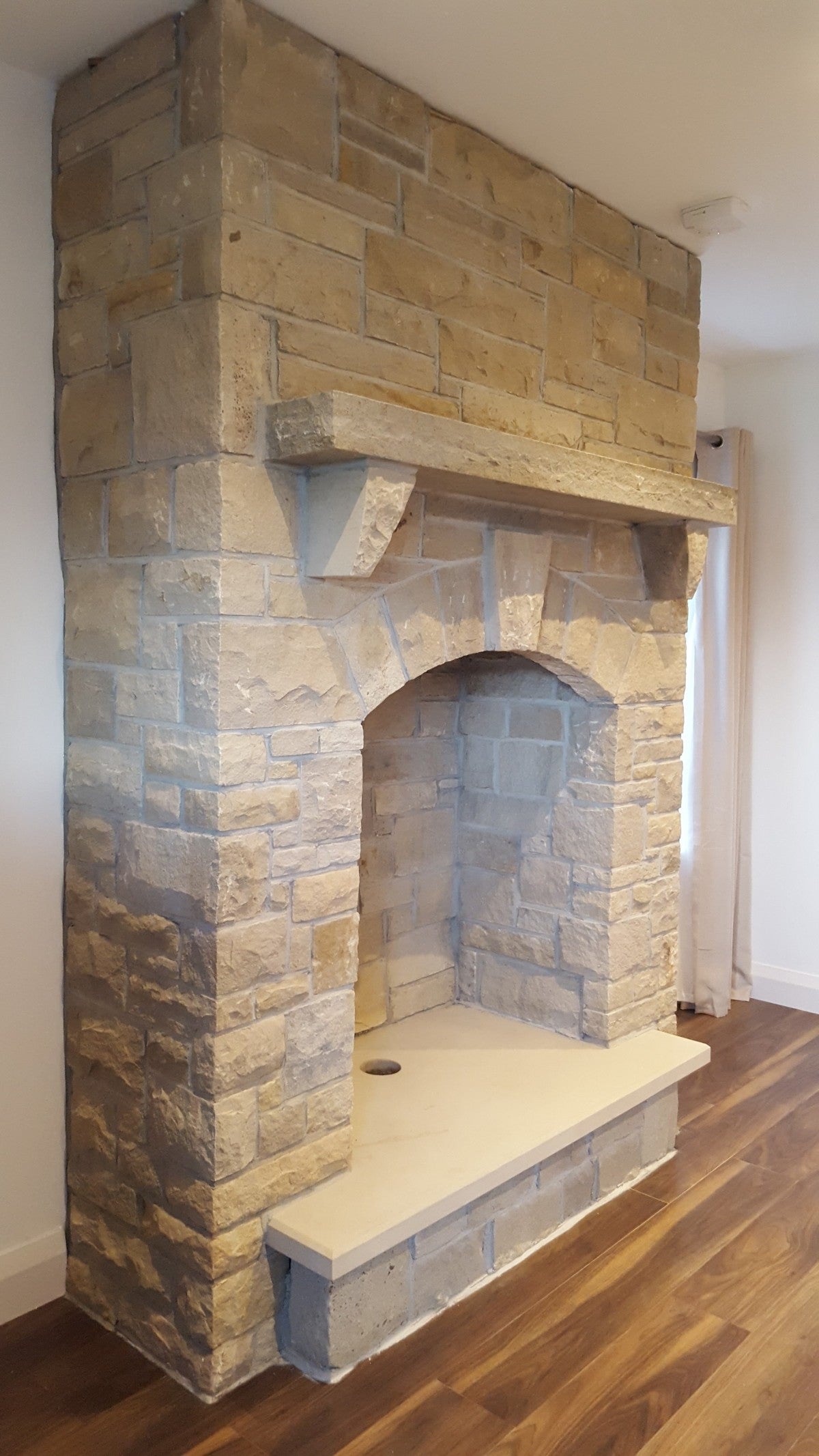 Beautiful Sandstone Fireplace completed with a bespoke Sandstone Hearth and Mantel with Rockfaced Edge. 