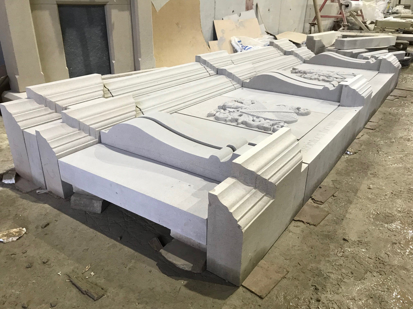 Architectural Sandstone Mantel with two carved family crests completed in McMonagle Stone's workshop. 