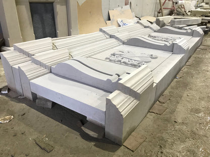 Architectural Sandstone Mantel with two carved family crests completed in McMonagle Stone's workshop. 