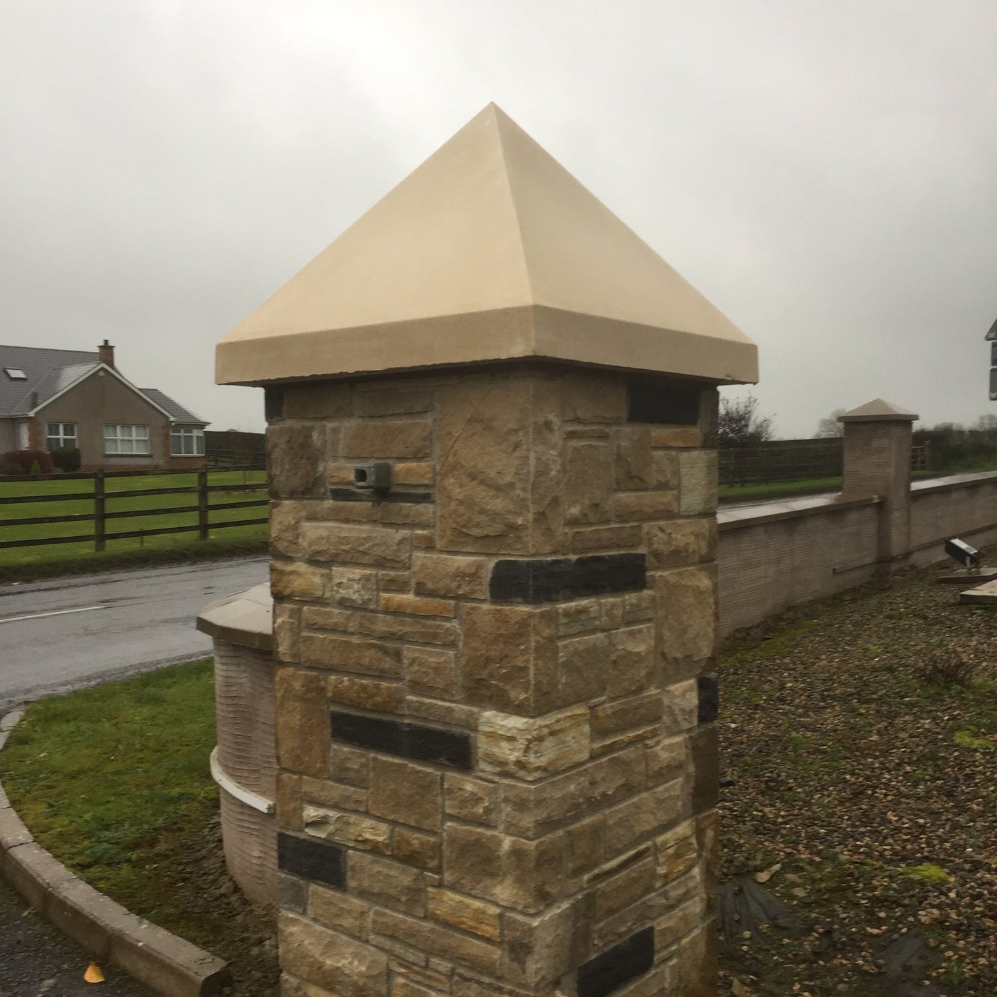 Stone pillar with bespoke sandstone pillar cap. 