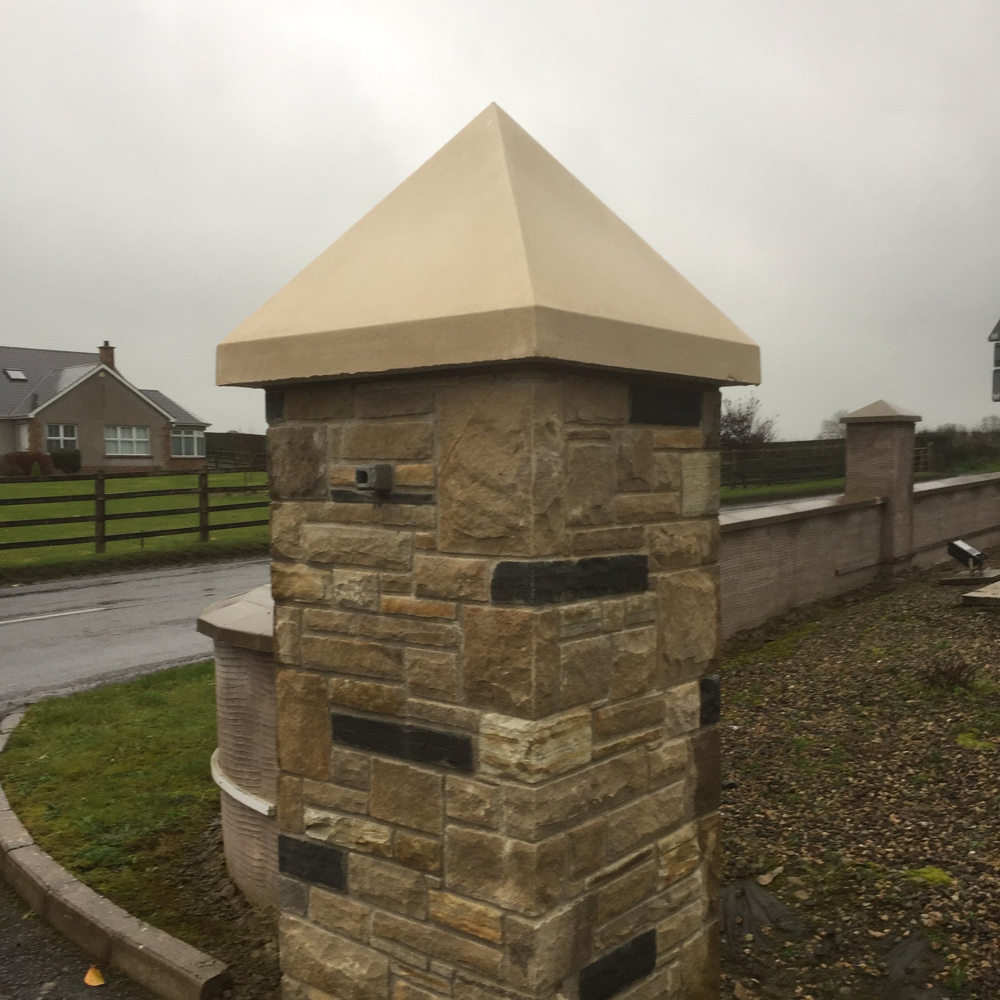 Stone pillar with bespoke sandstone pillar cap. 