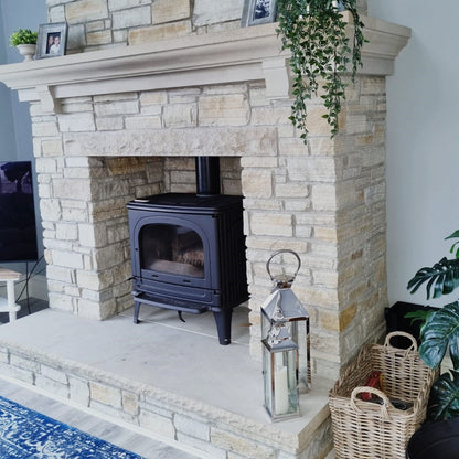 Bespoke Sandstone Hearth and Mantel on a Gold Donegal Quartzite Fireplace. 