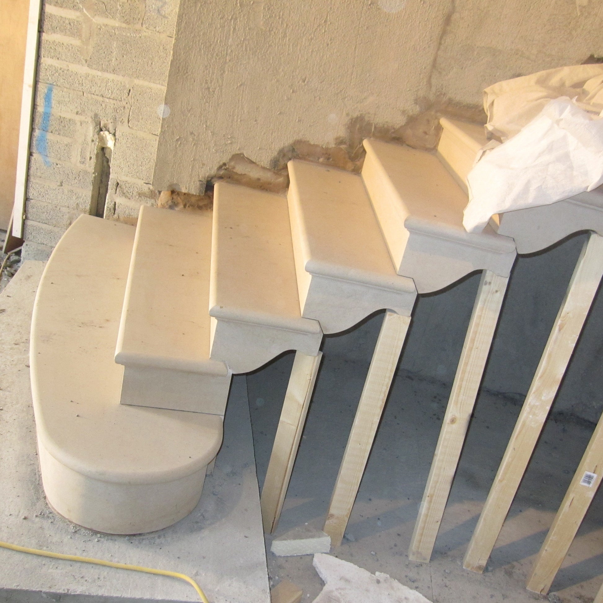 Bespoke sandstone steps being installed in new build home. 