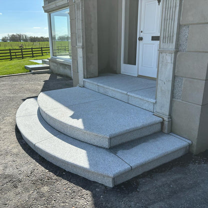 Bespoke Silver Granite Steps with curved design at front entrance.