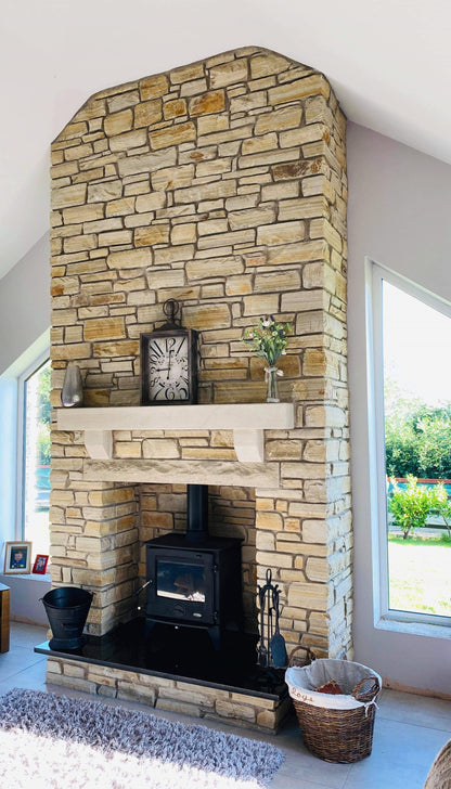 Gold Donegal Quartzite Fireplace with a bespoke Sandstone Mantel 