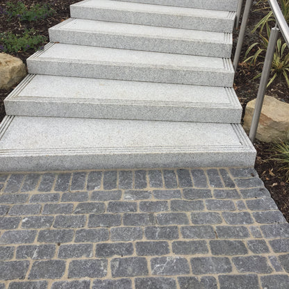 Silver Granite steps with Black Granite Paving Cobbles in 200 x 100mm size. 
