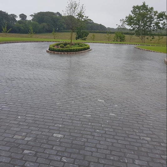 Large driveway completed using Black Granite Cobbles in 200 x 100mm size.