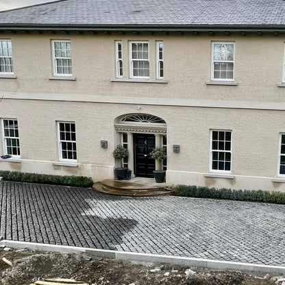Large house with a cobbled driveway and garden area. Driveway was completed using Black Granite Cobbles in 100 x 100mm size. 
