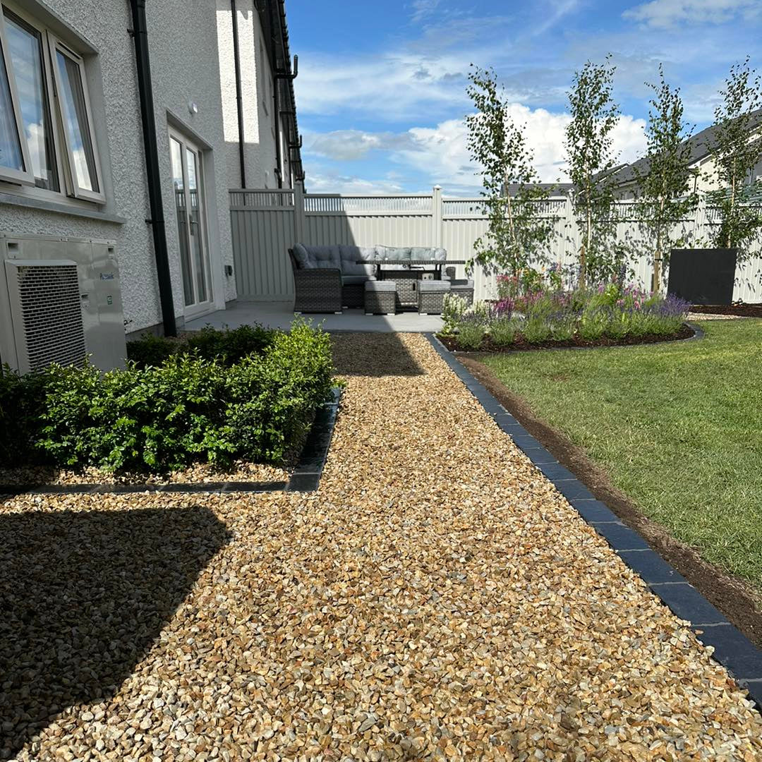 Garden pathway with Black Limestone Cobble edging in 200 x 100mm size.
