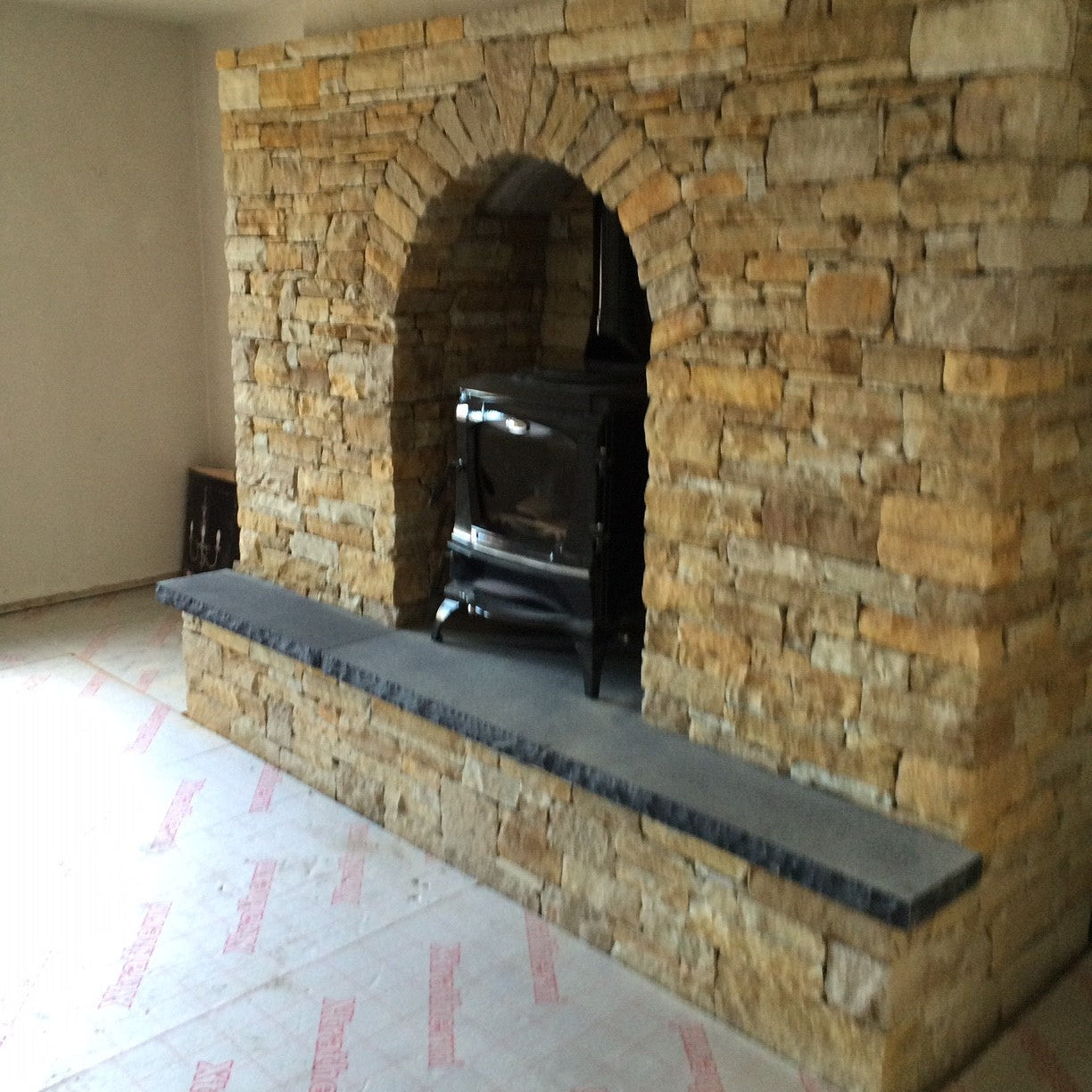 Gold Donegal Quartzite Fireplace with Bespoke Black Limestone Hearth