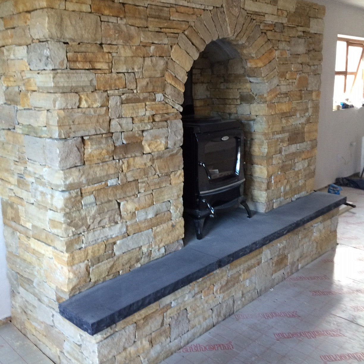 Donegal Quartzite Fireplace with Bespoke Black Limestone Hearth