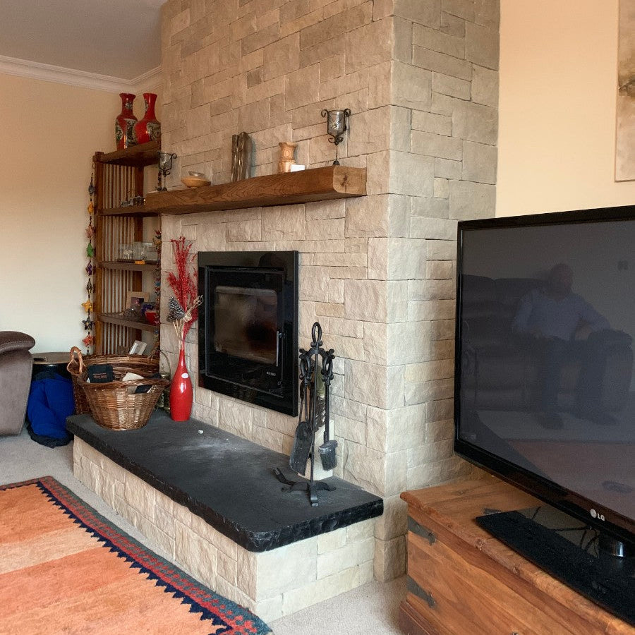Sandstone Fireplace with Bespoke Black Limestone Hearth with a Rockfaced Edge
