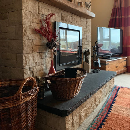 Sandstone Fireplace with Bespoke Black Limestone Hearth with a Rockfaced Edge