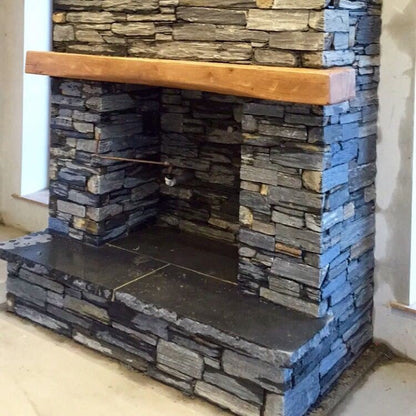 Bespoke Black Limestone Hearth on a slate fireplace. 