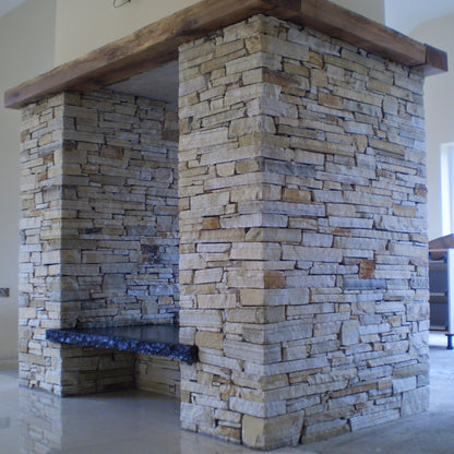 Bespoke Black Limestone Hearth on a Donegal Quartzite Double Sided Fireplace