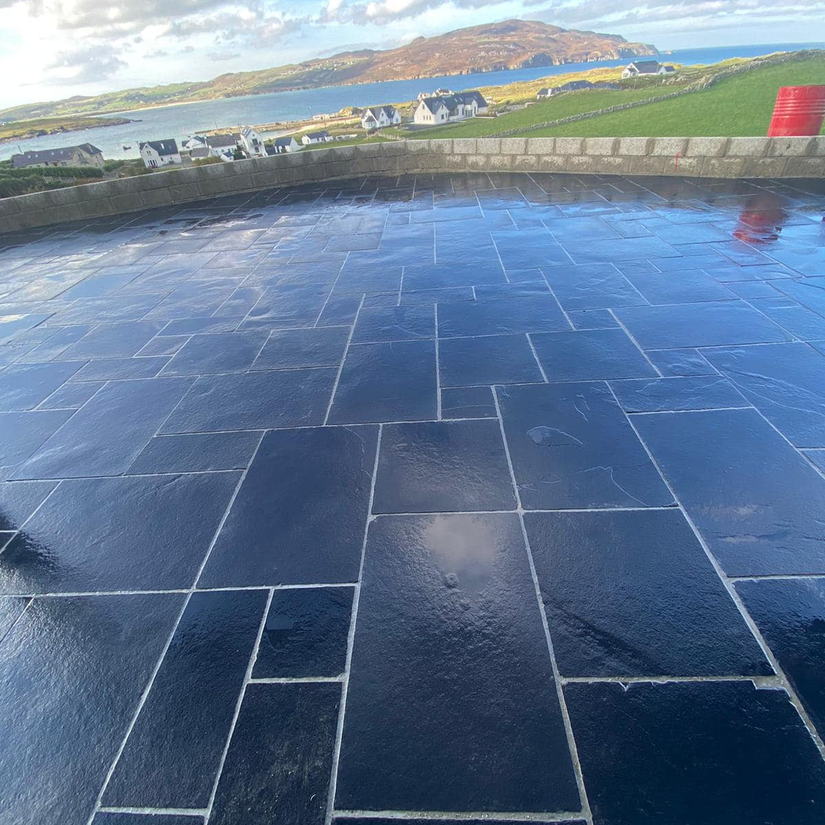 Patio area with scenic view overlooking the sea. Paving is Black Limestone Patio Packs.