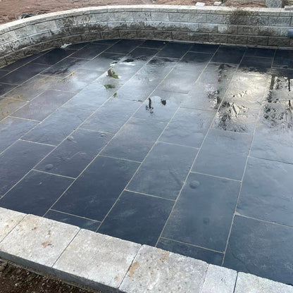 Patio featuring Black Limestone Paving in 900 x 600mm size. 