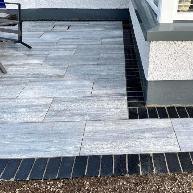 Patio with border completed using Black Limestone Paving Cobbles in 200 x 100mm