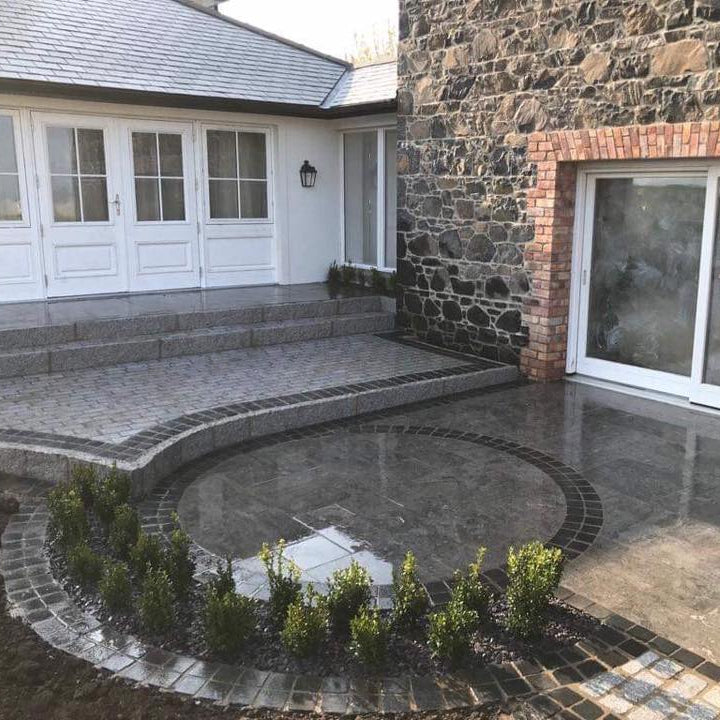 Patio design featuring Black Limestone Paving Cobbles in 100 x 100mm size. 