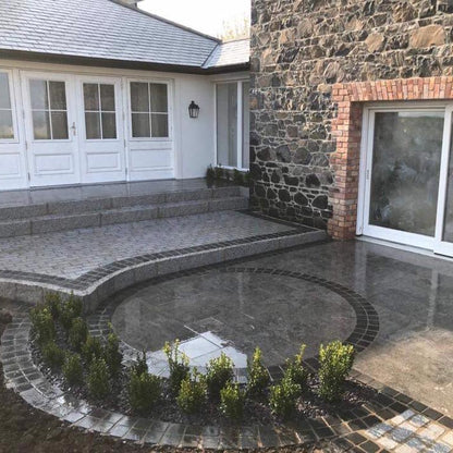Patio design featuring Black Limestone Paving Cobbles in 100 x 100mm size. 