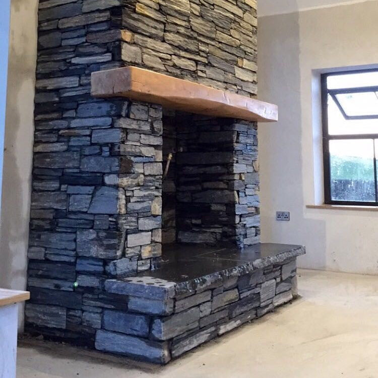Bespoke Black Limestone Hearth on a slate fireplace. 