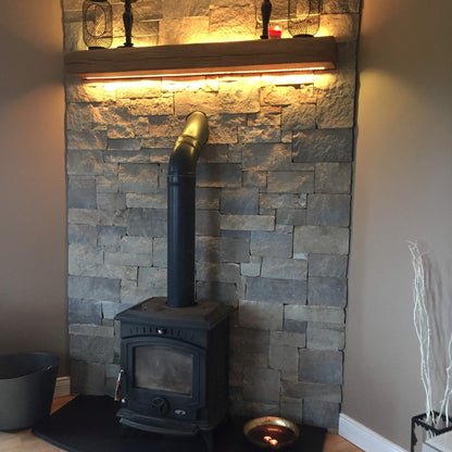 Internal fireplace feature wall completed using Blue Centre Sandstone Stoneer Cladding Flats. 