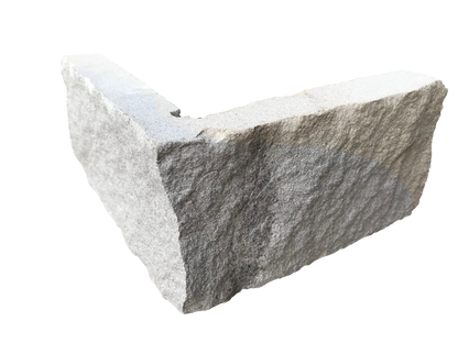 An L-shaped corner piece of Blue Centre Sandstone Stoneer, with a blend of blue and buff tones.