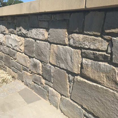 Boundary wall with Blue Grey Sandstone Machined walling stone. 