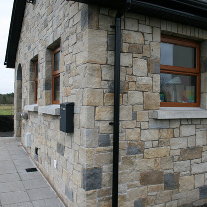 Stone façade completed in a beautiful sandstone mix containing Blue Grey Sandstone Stoneer Cladding. 
