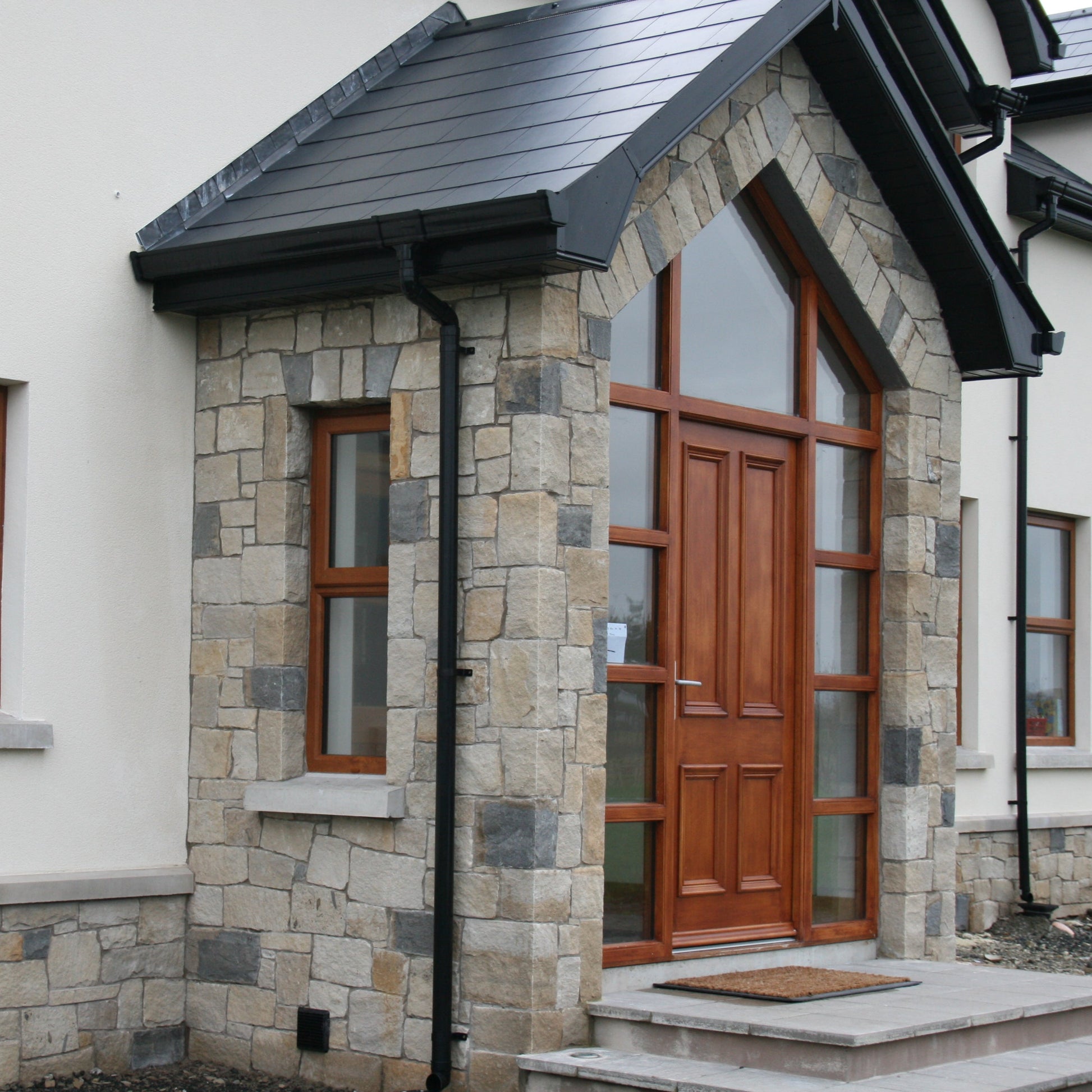 Stone porch cladded in sandstone mix featuring Blue Grey Sandstone Stoneer Cladding.  