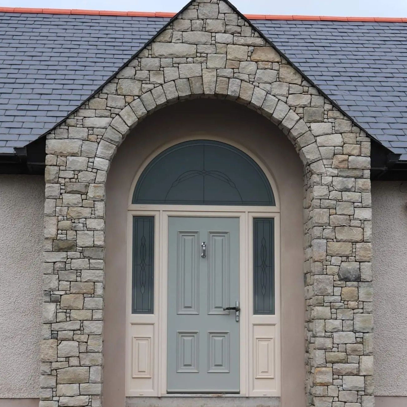 Stone clad entrance completed using Blue Grey Sandstone Stoneer Cladding. 