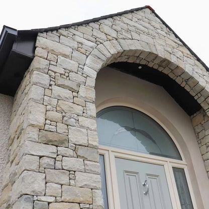 Close up of a stone-clad entrance featuring a stonework mix containing Blue Grey Sandstone.